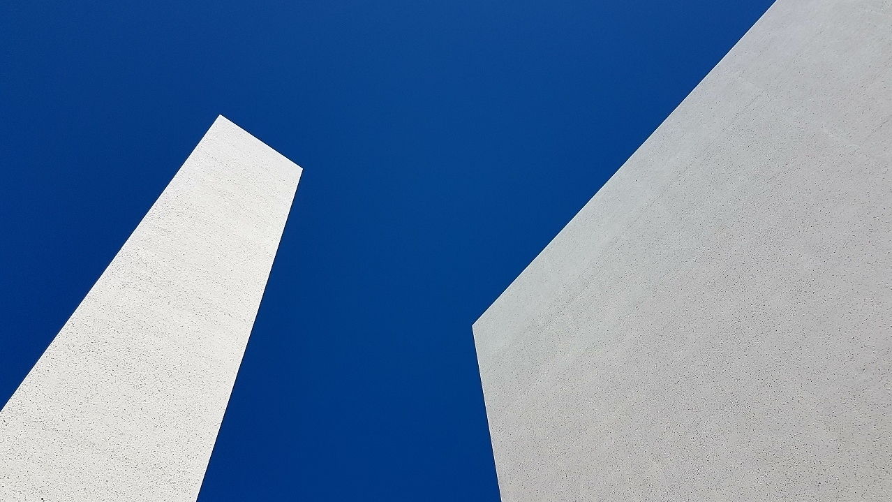 Low Angle View Of Building Against Blue Sky